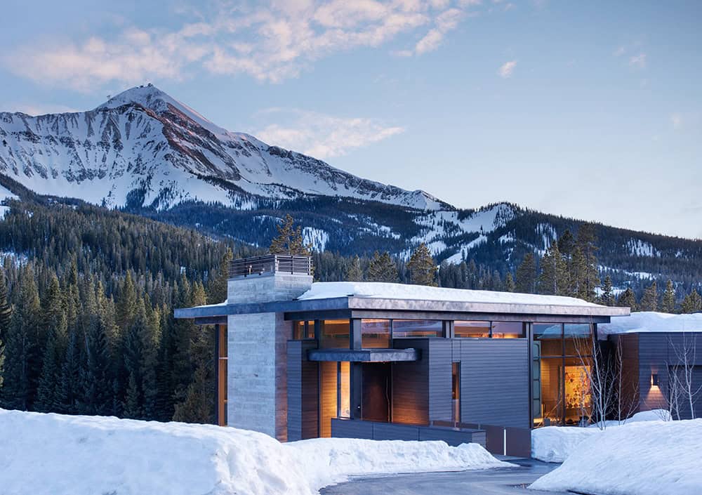 mountain home exterior with snow