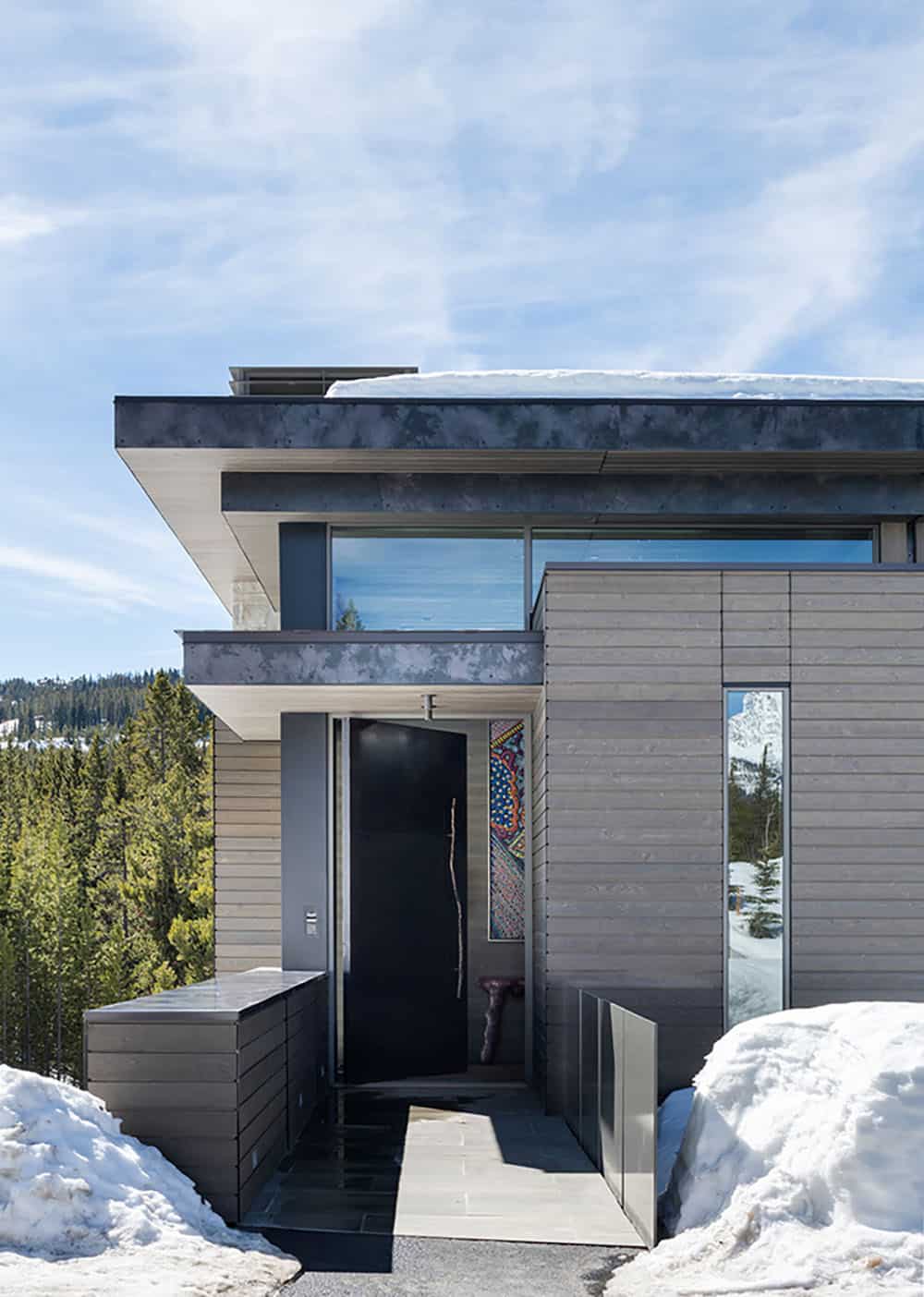 mountain home exterior with snow