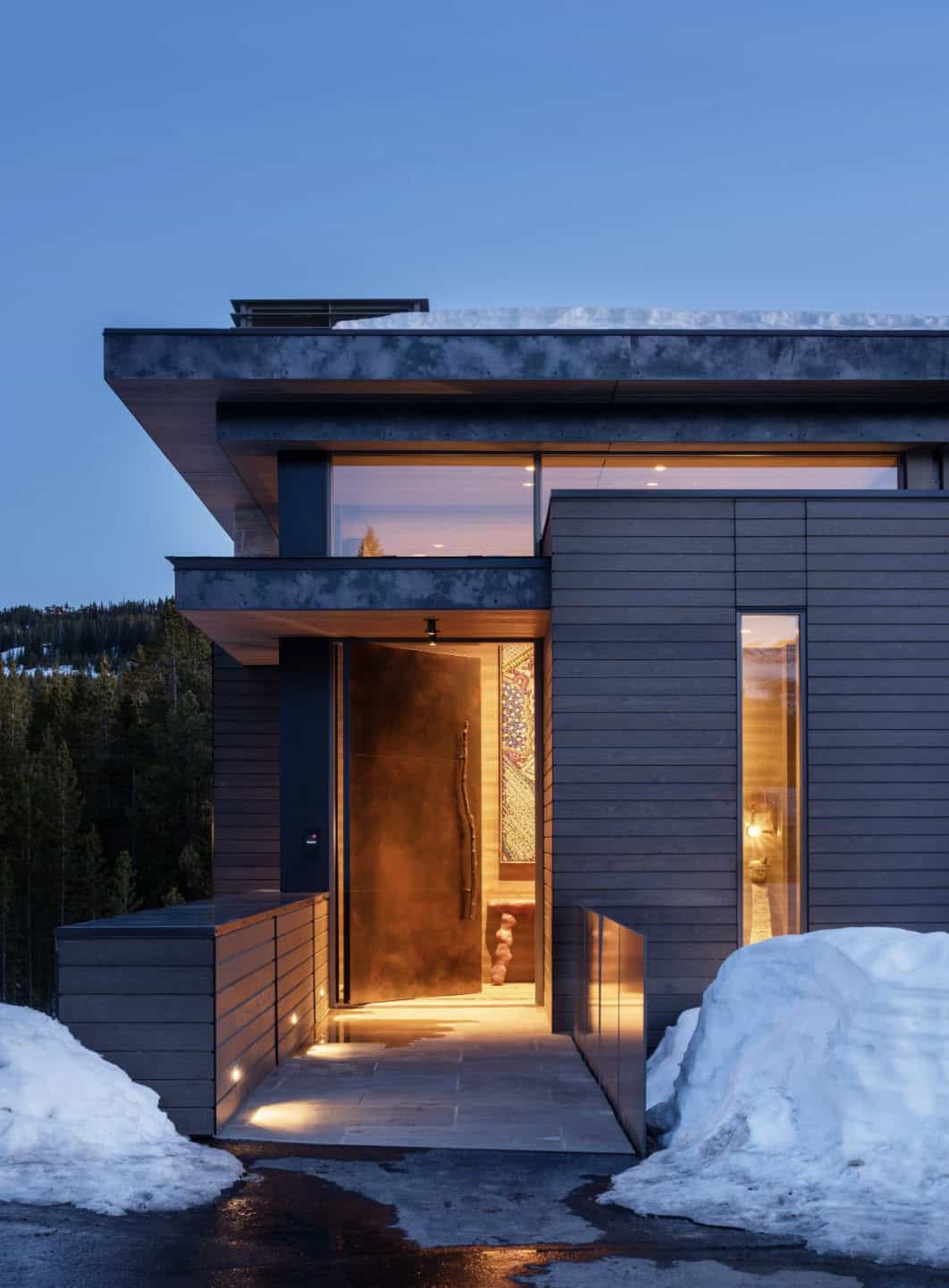 mountain home exterior with snow