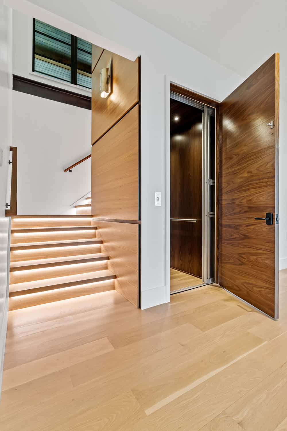 modern lower level staircase and elevator