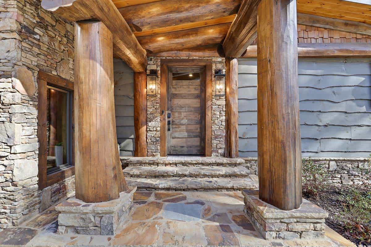 modern rustic log frame cabin exterior entry