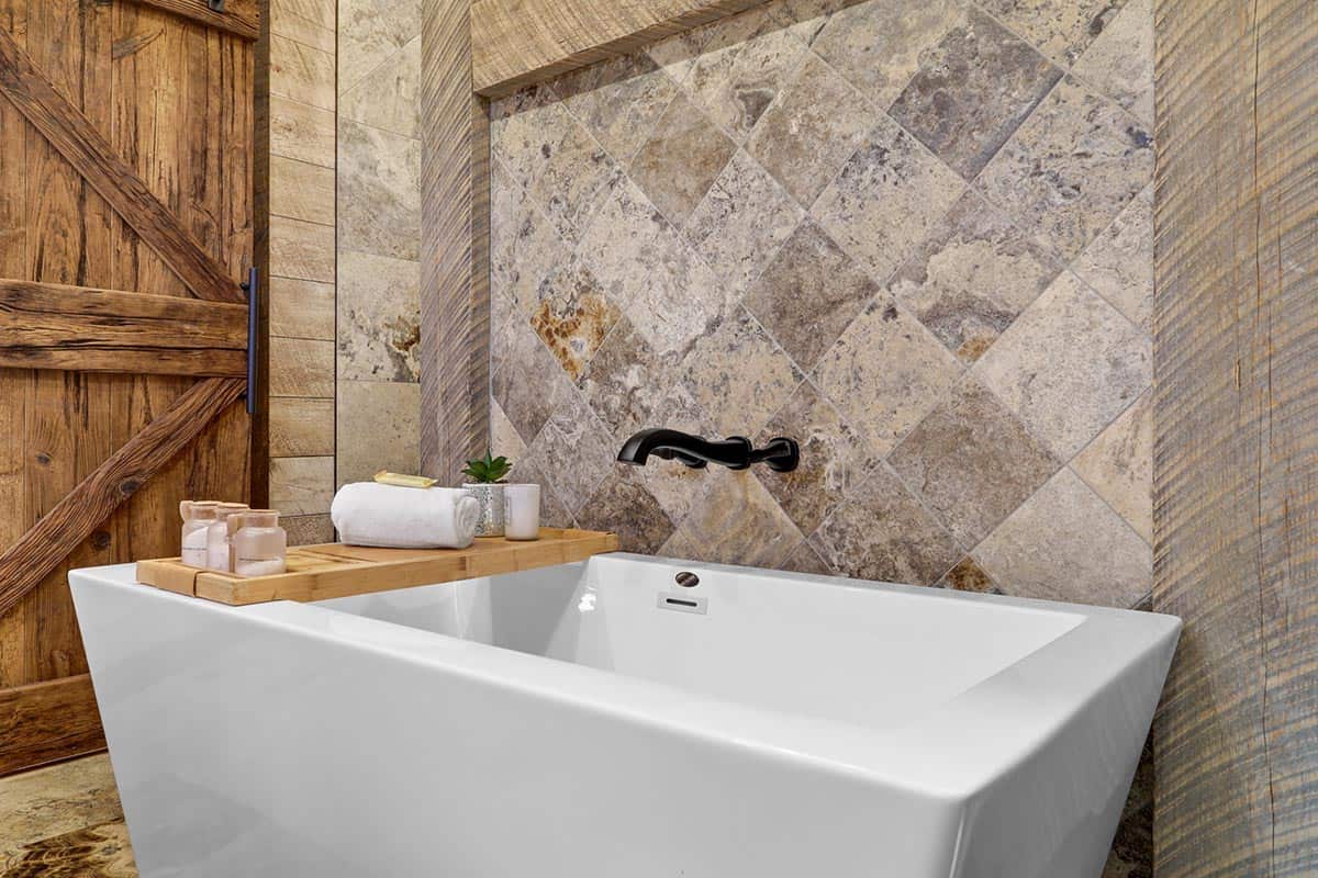 modern rustic bathroom with a soaking tub