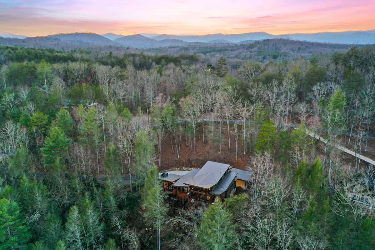 modern rustic log frame cabin exterior aerial view