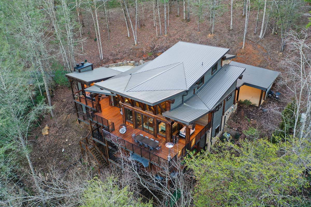 modern rustic log frame cabin exterior aerial view