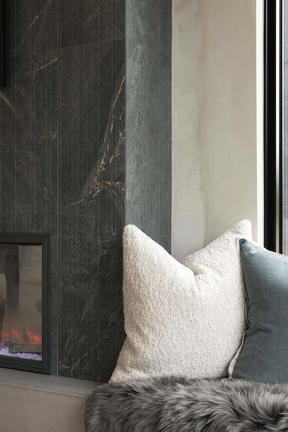 modern living room with a fireplace and built-in seat