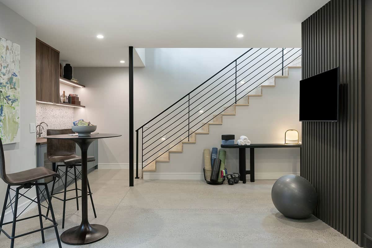 modern basement level with a home bar