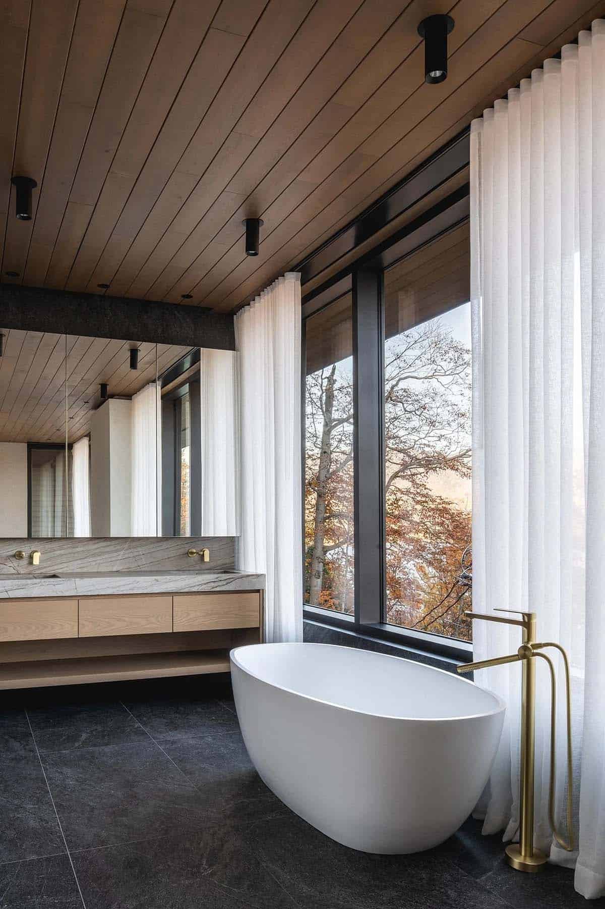 modern bathroom with a vanity and freestanding tub