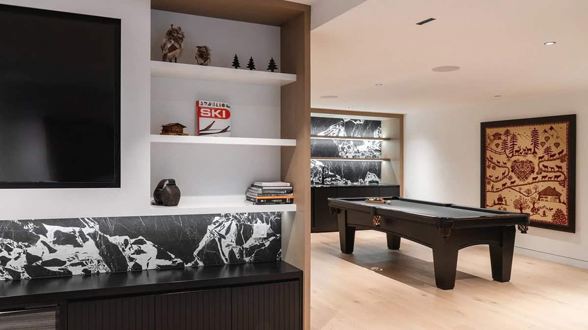 modern family room with a pool table and wet bar