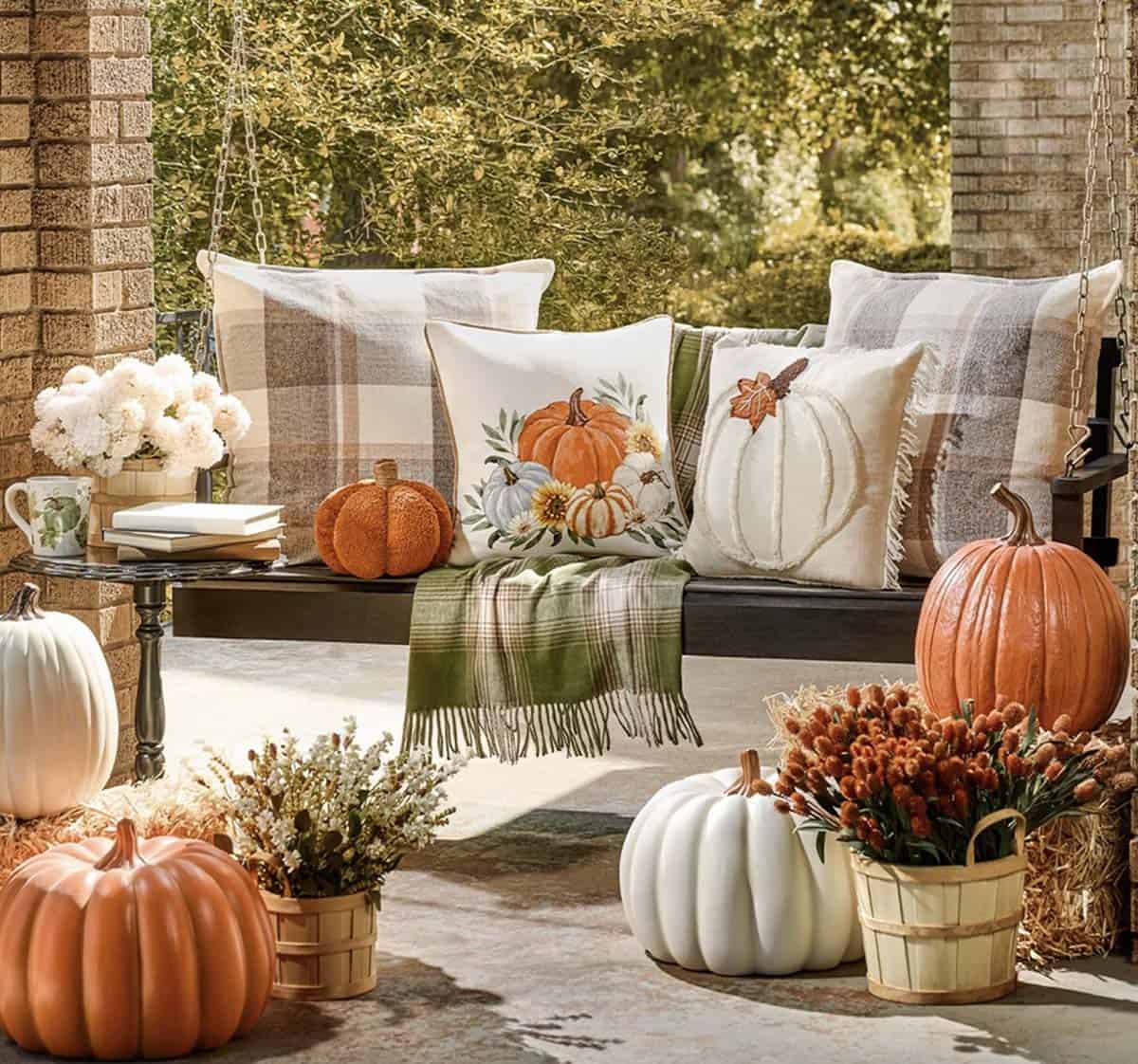 outdoor porch swing with fall pillows