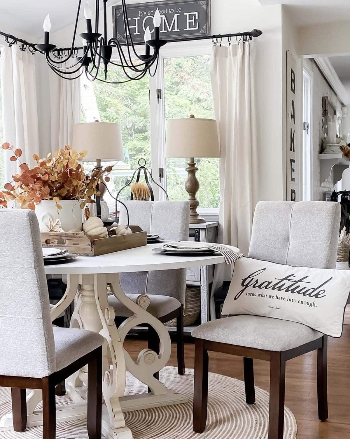 fall decorated dining table with an accent pillow