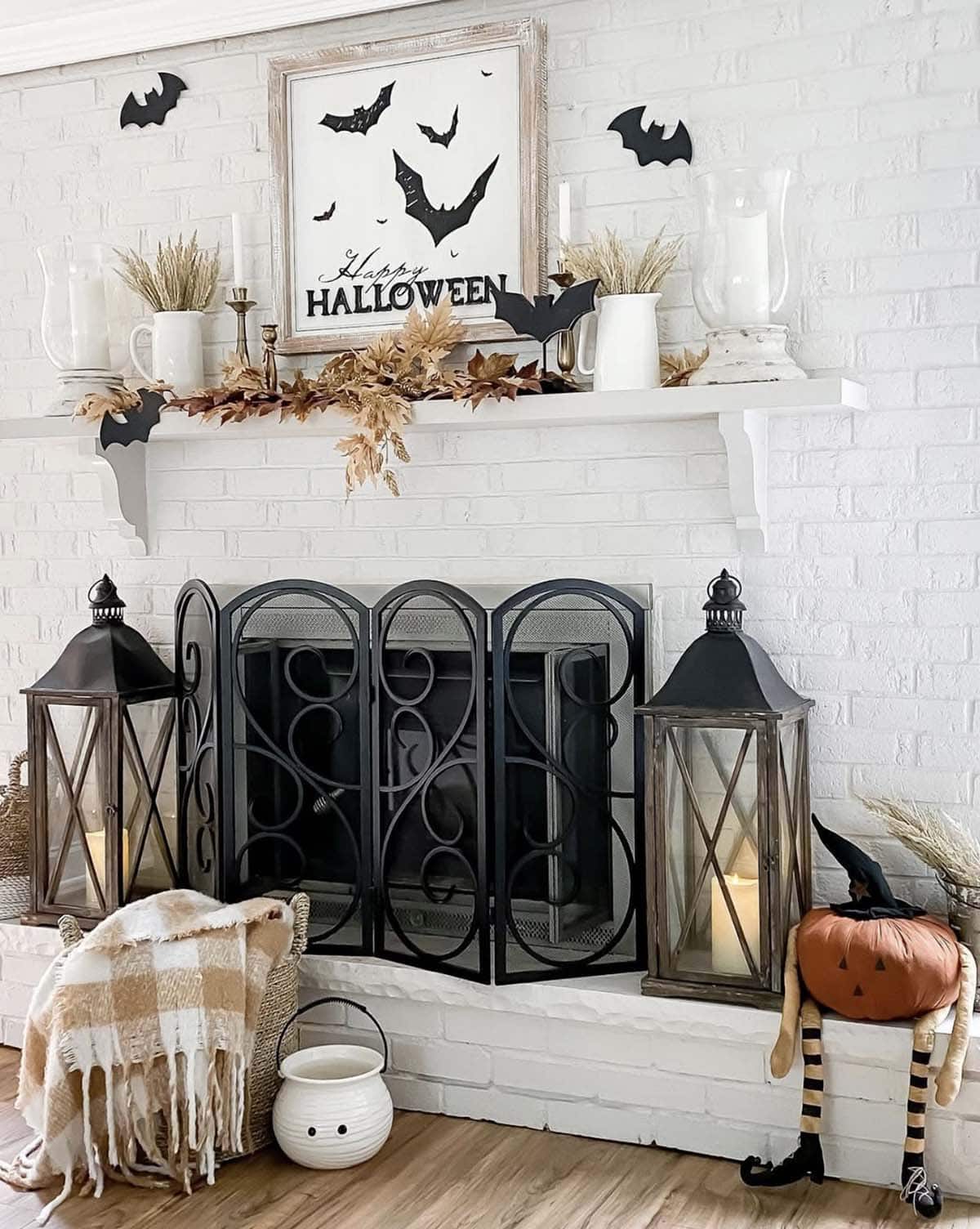 fireplace decorated for fall with lanterns