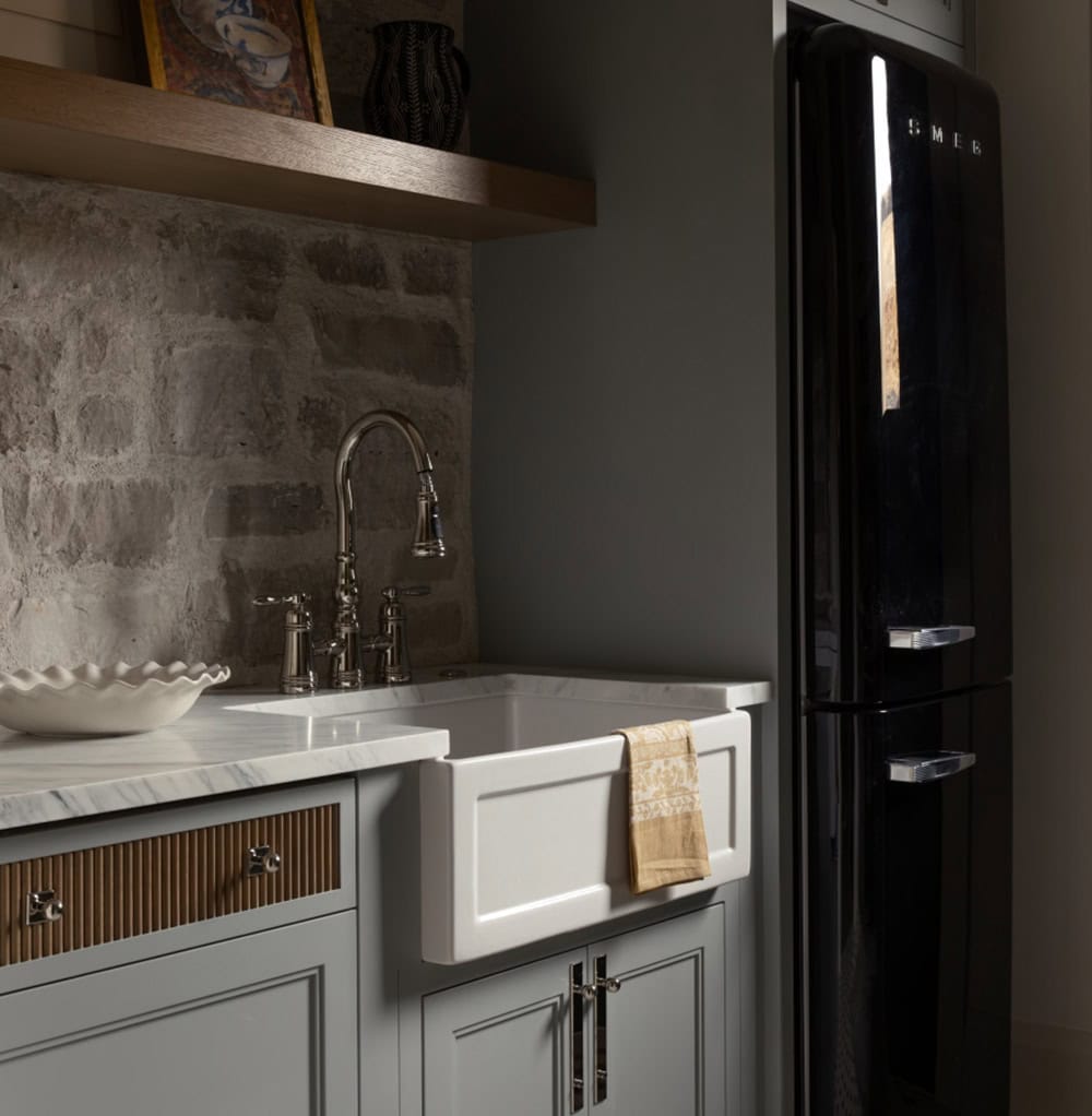 contemporary mudroom with a fridge