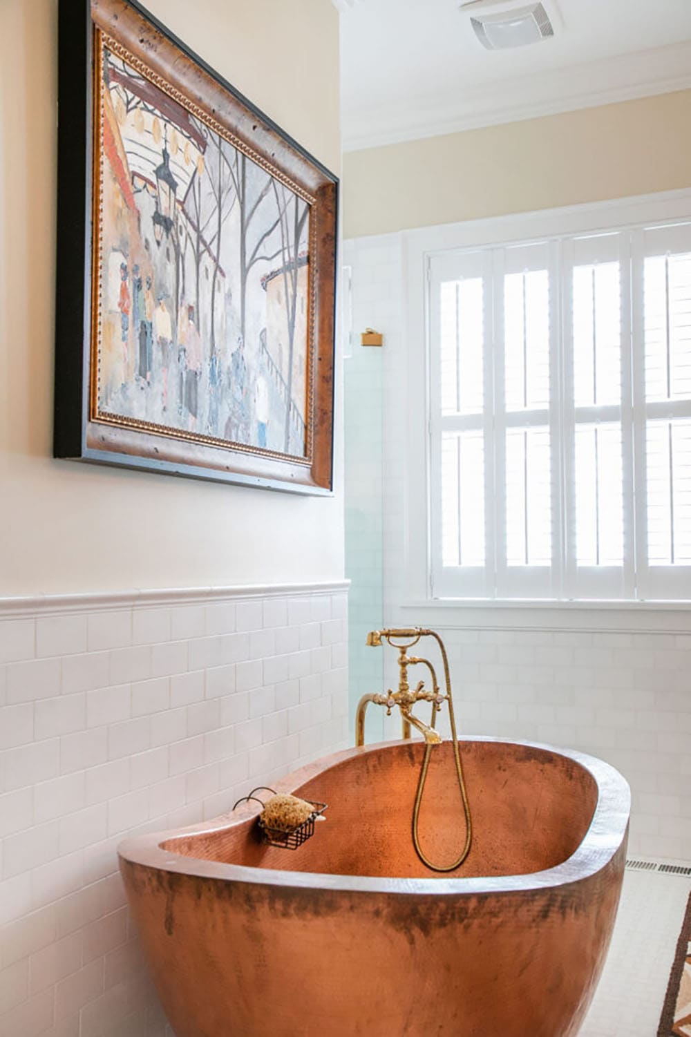traditional style bathroom with a freestanding tub