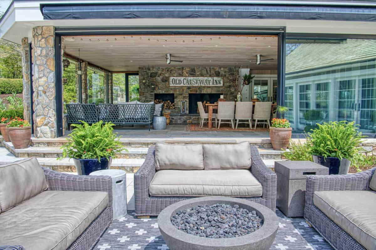 transitional style patio with outdoor furniture and a fire pit
