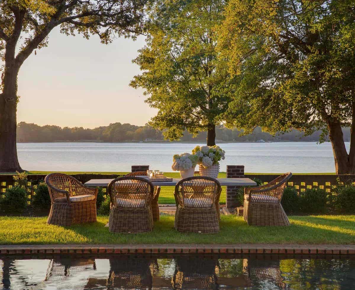 waterfront home with a pool and outdoor dining