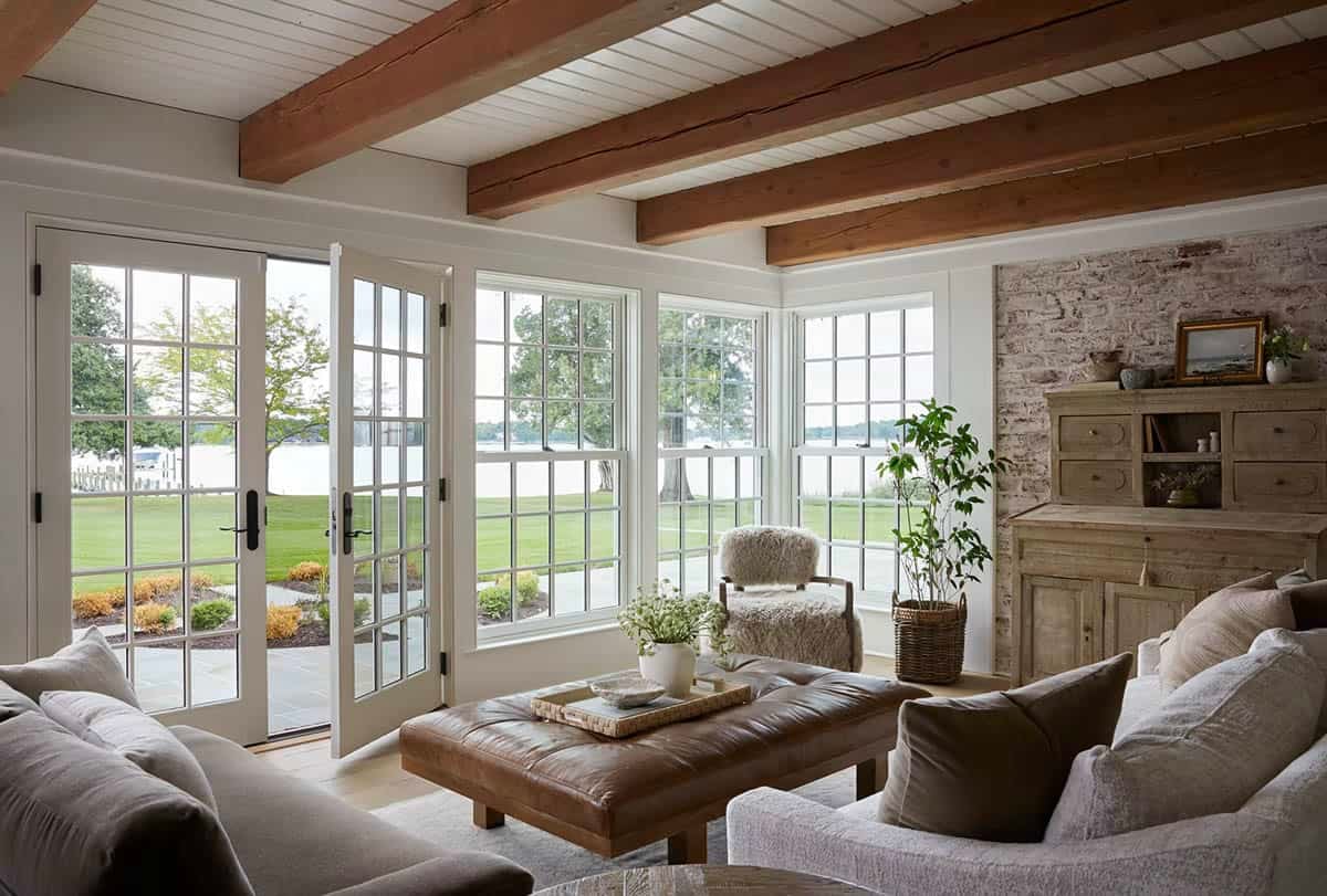contemporary sunroom with a fireplace