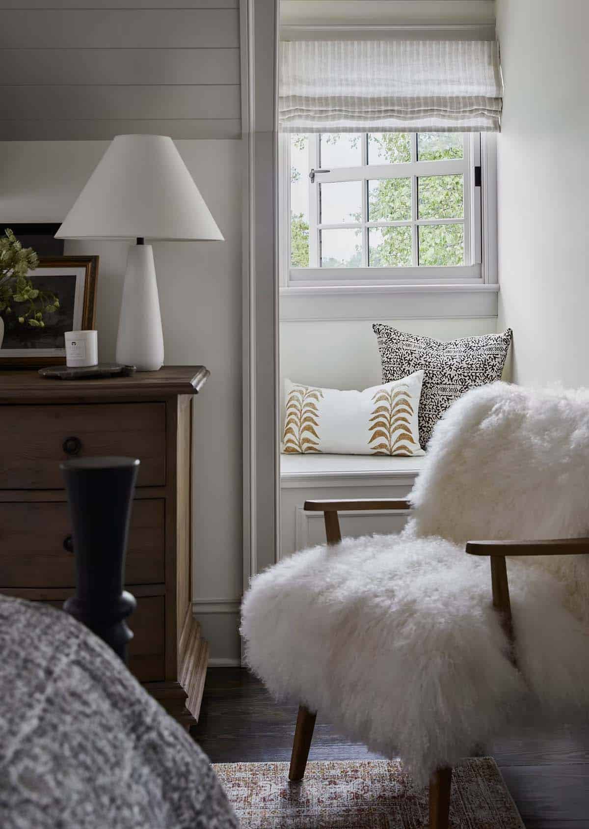 contemporary bedroom with a reading chair