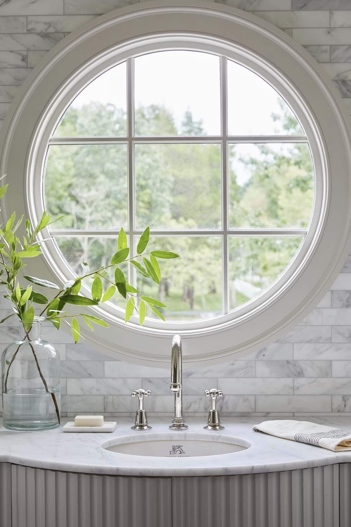 contemporary bathroom vanity with a round window
