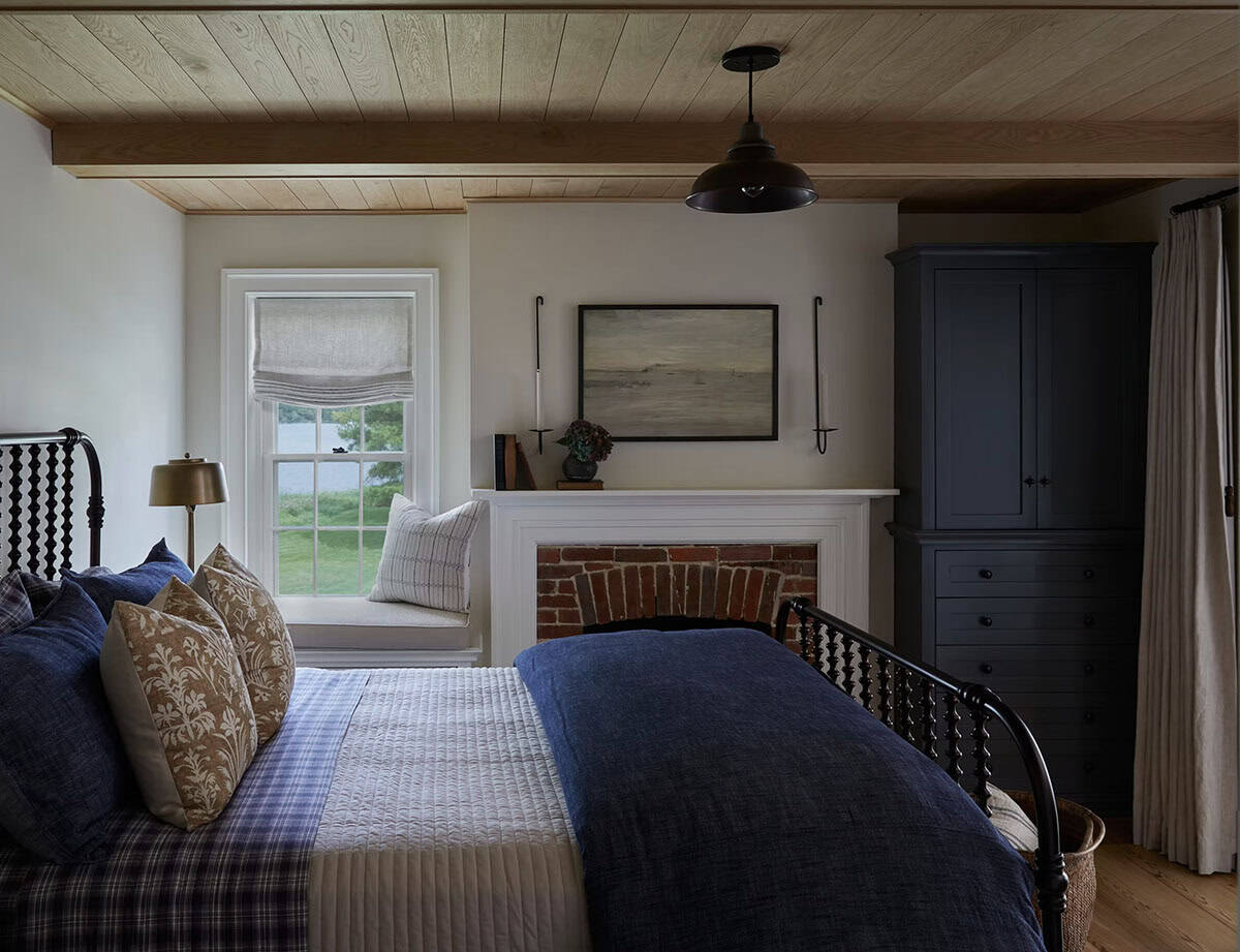 contemporary bedroom with a fireplace