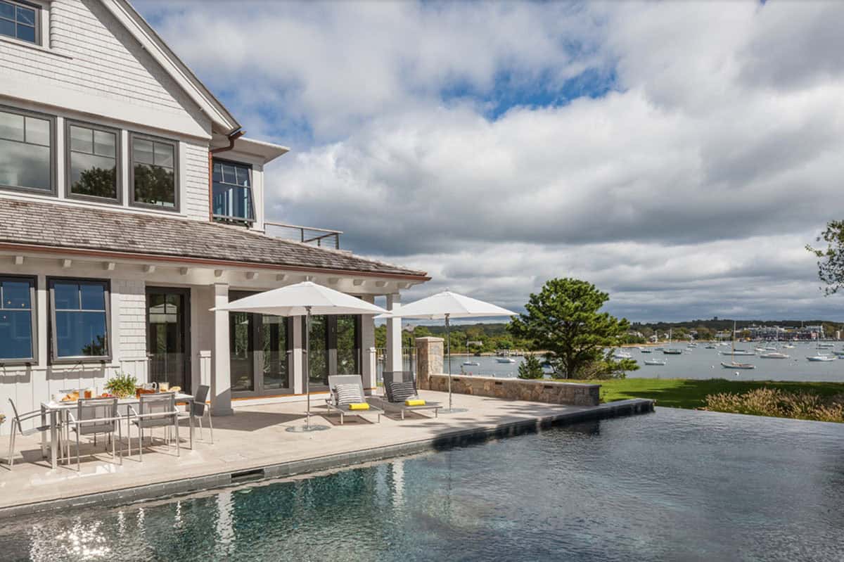 beach style house exterior with a pool