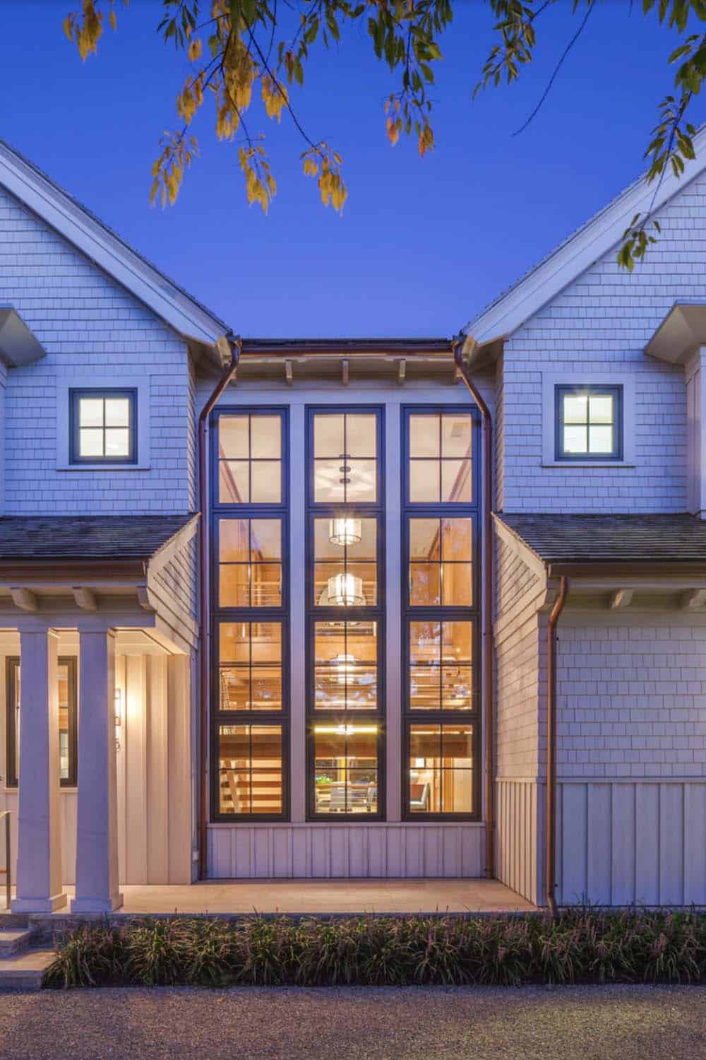 beach style house exterior at dusk