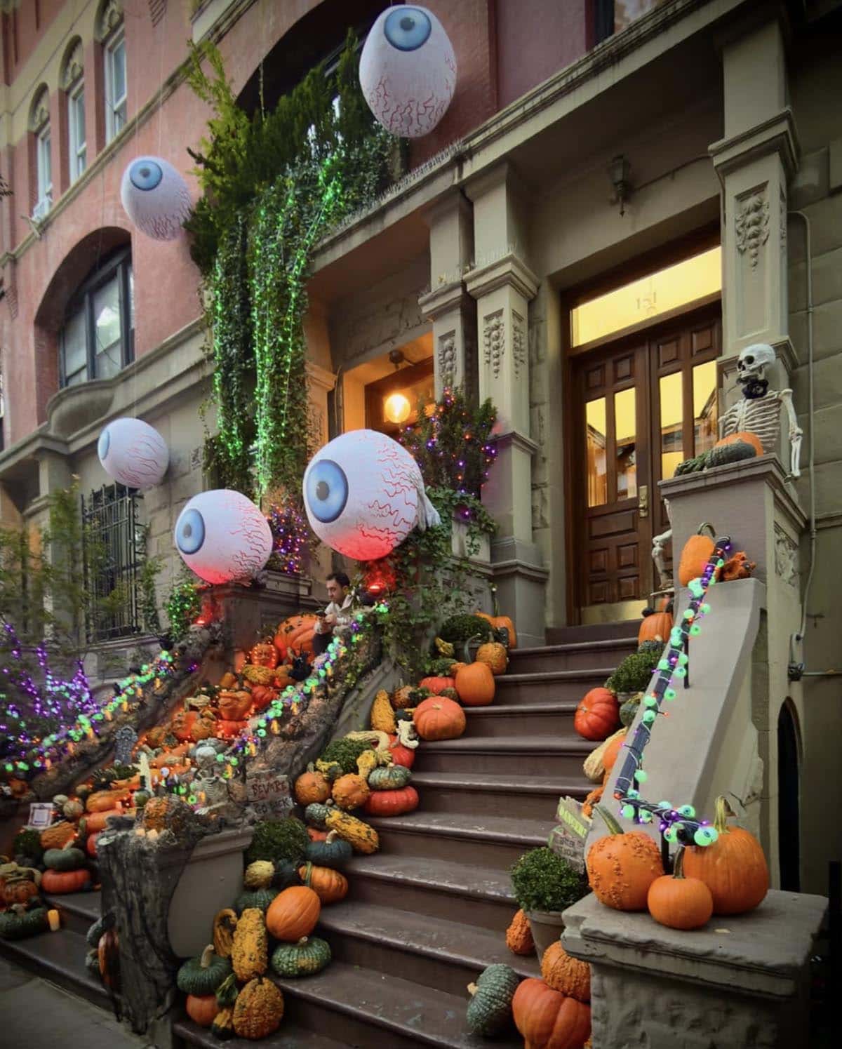 outdoor halloween decorations with face pumpkins and large eyeballs