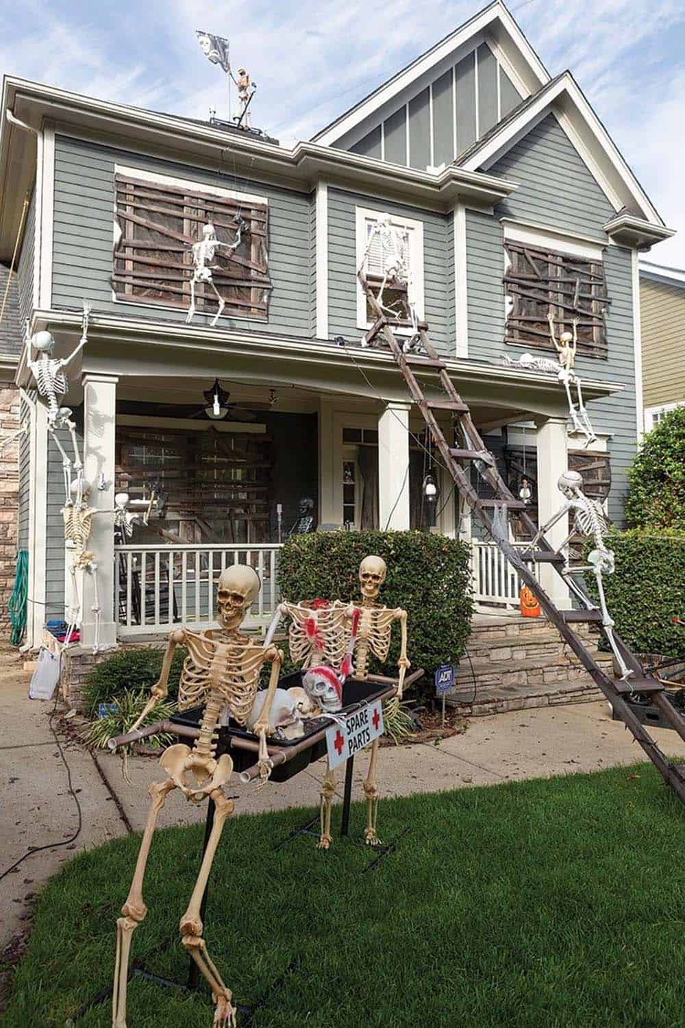 front yard halloween decor with skeletons