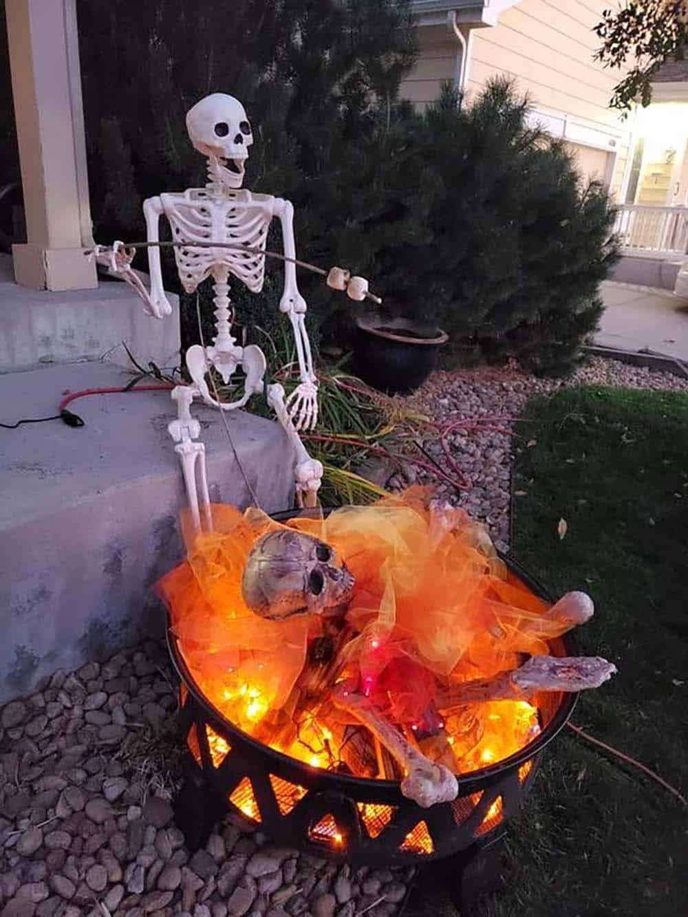 halloween front yard decorations with a skeleton bonfire