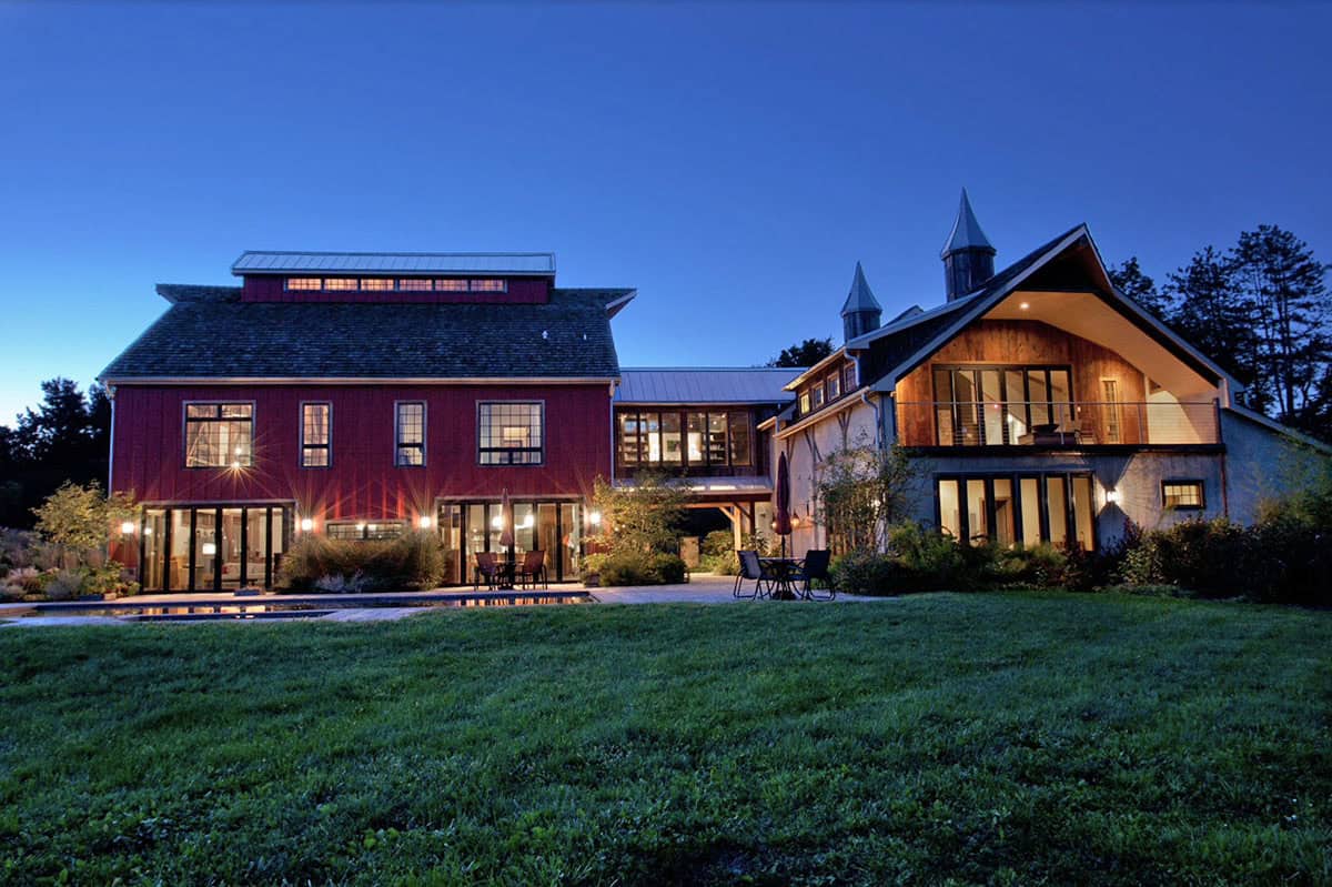 rustic modern barn house exterior at dusk