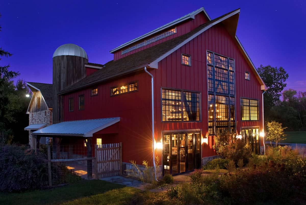 rustic modern barn house exterior at dusk