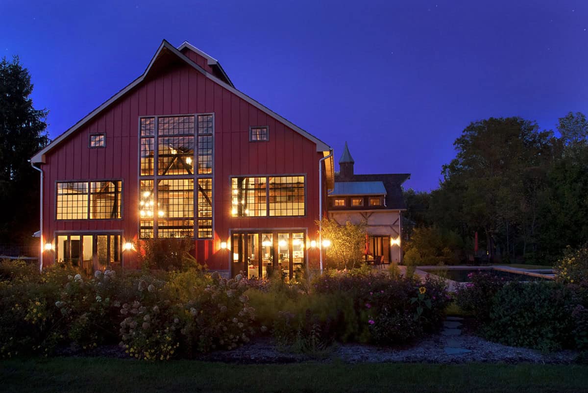 rustic modern barn house exterior at dusk