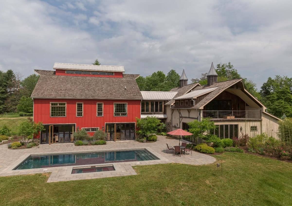 rustic modern barn house exterior with a pool
