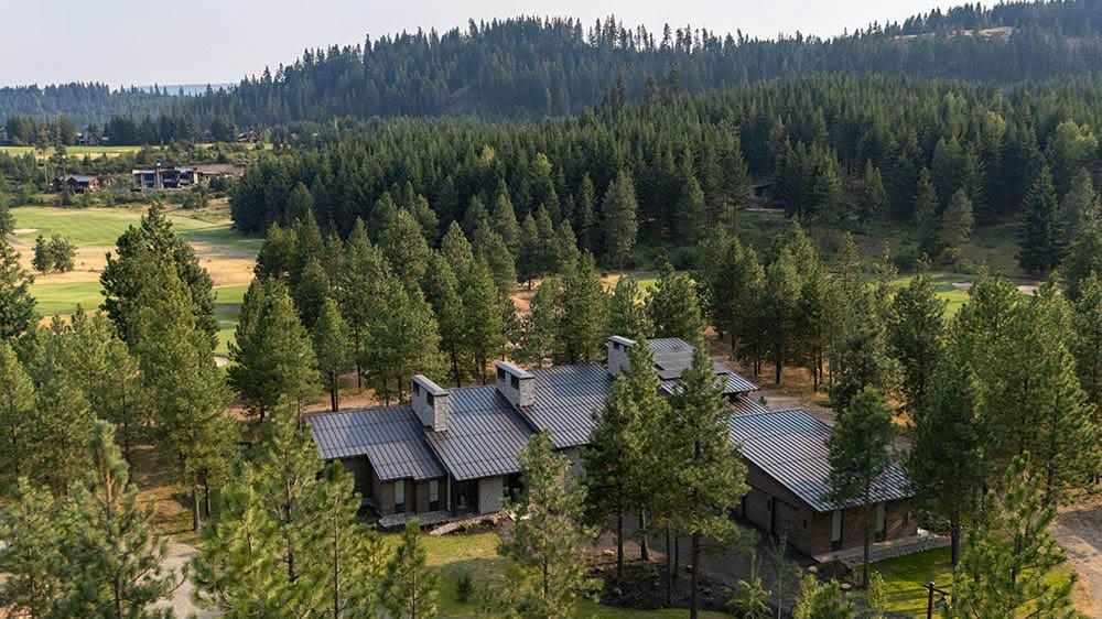 modern mountain home exterior aerial view
