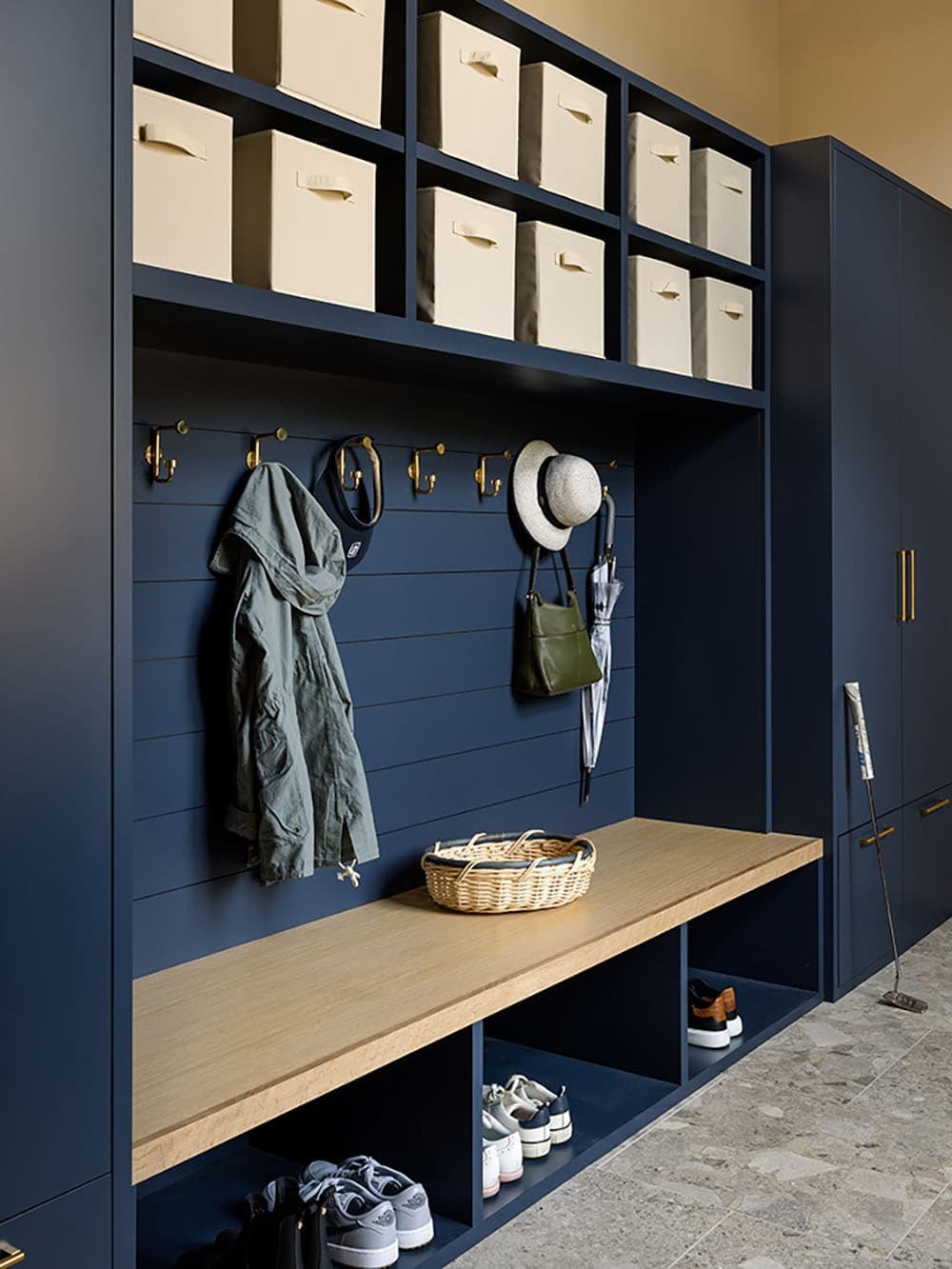 modern mudroom with a built-in bench