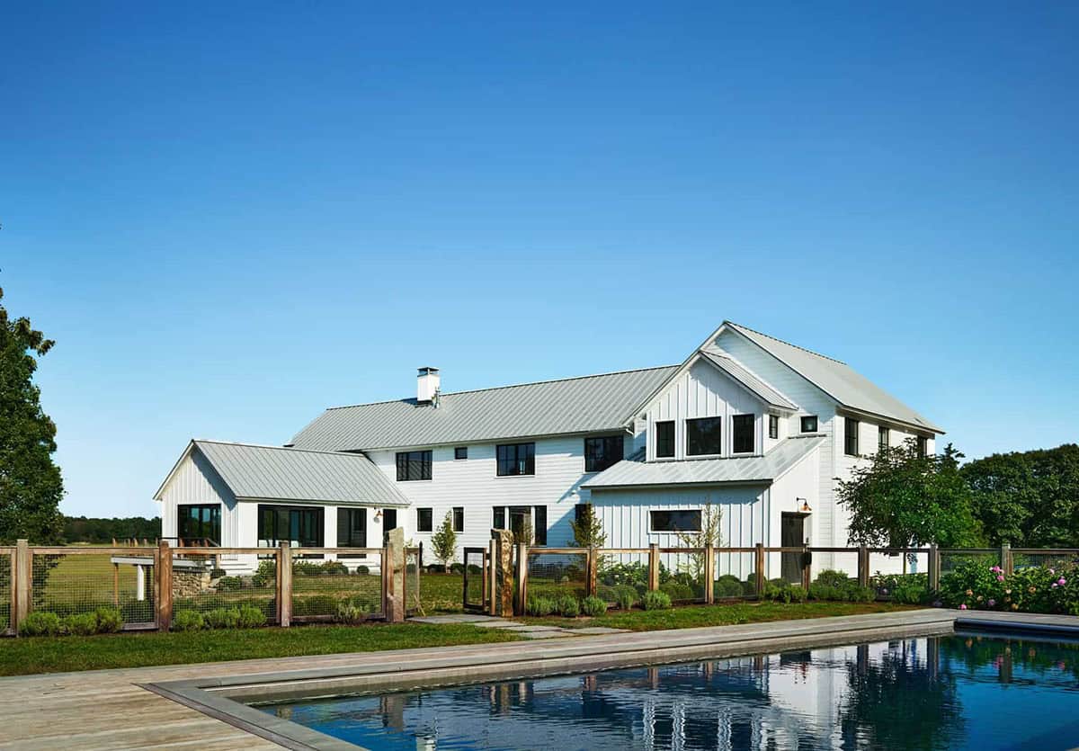 coastal modern farmhouse exterior backyard view with a pool