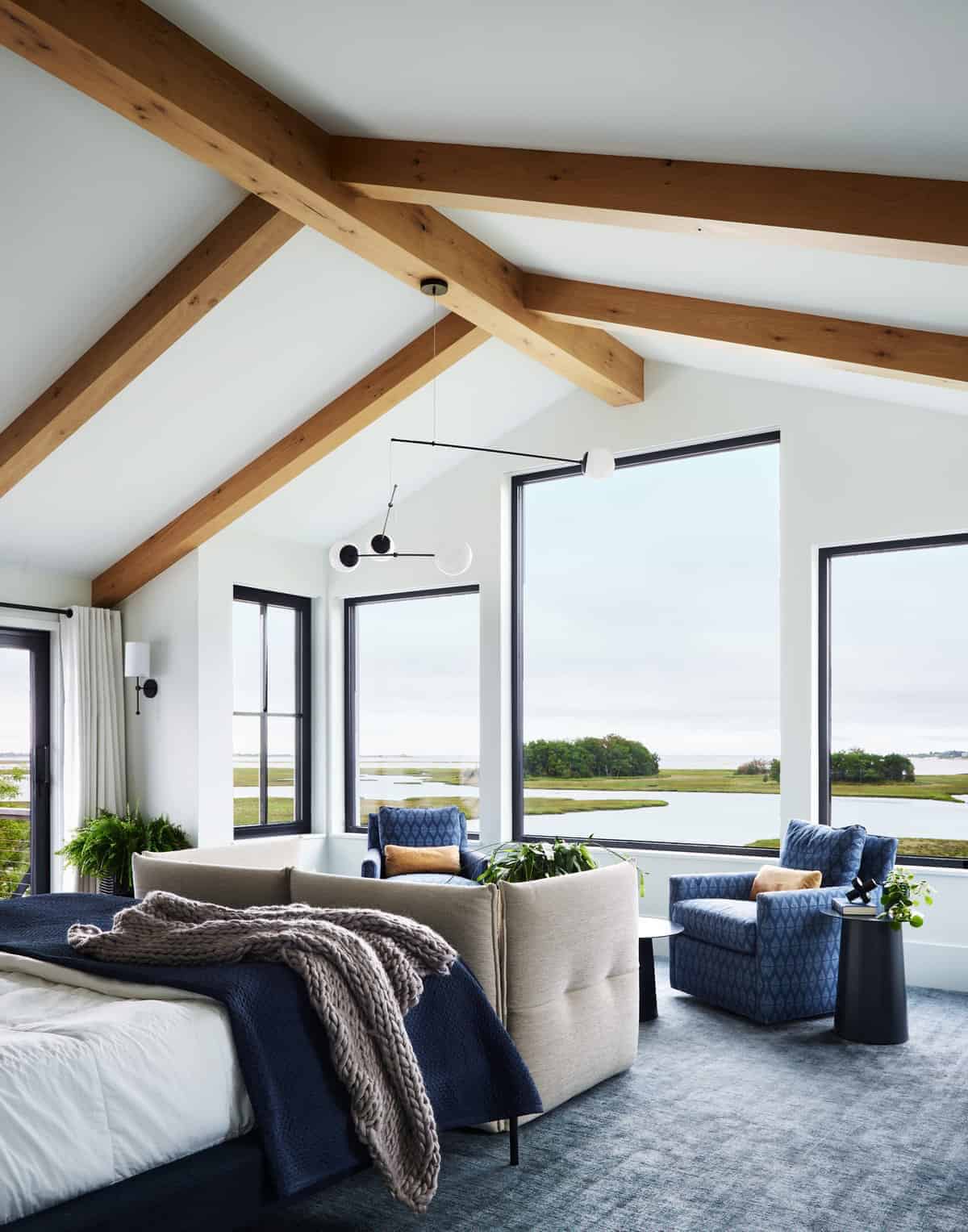 coastal modern farmhouse bedroom with large windows