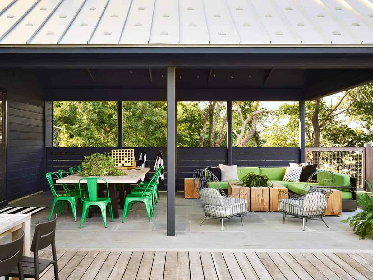 coastal modern farmhouse with a covered patio and outdoor furniture