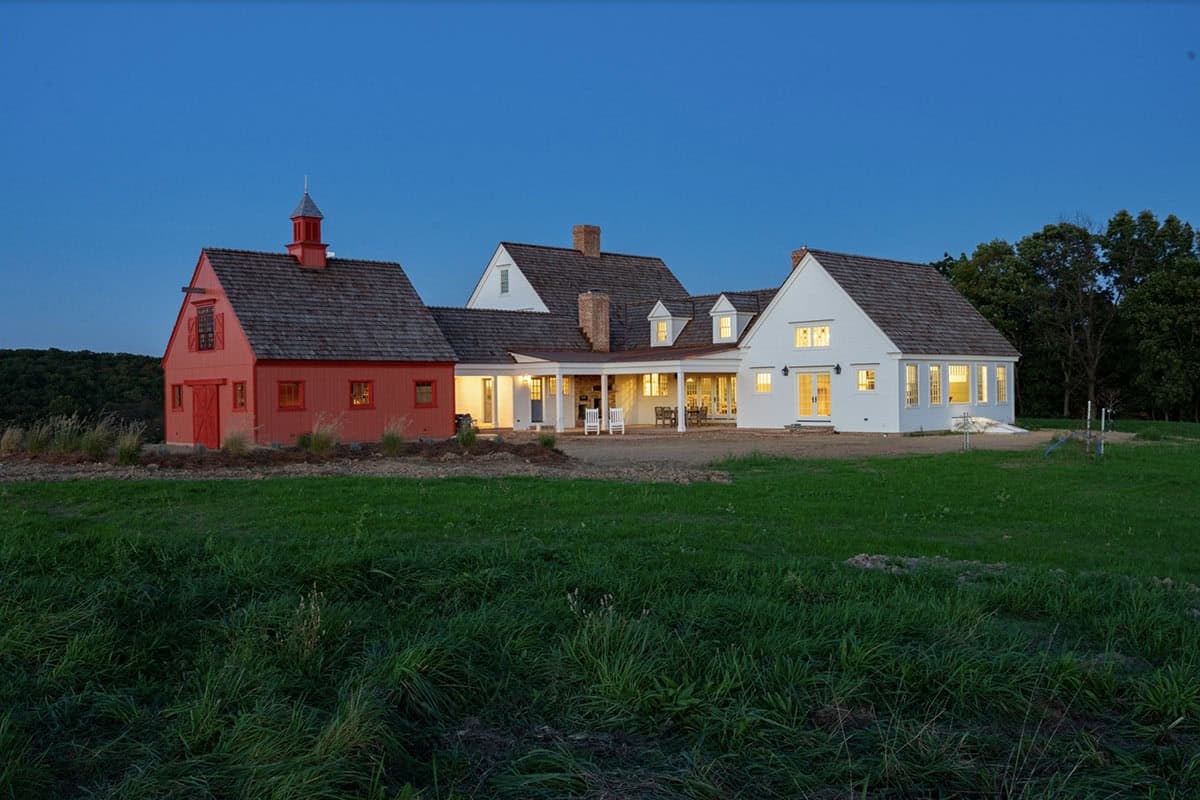 colonial farmhouse exterior at dusk