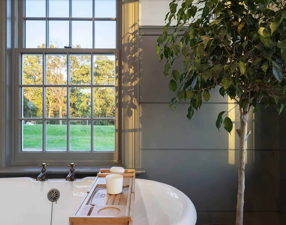 farmhouse style bathroom with a freestanding tub