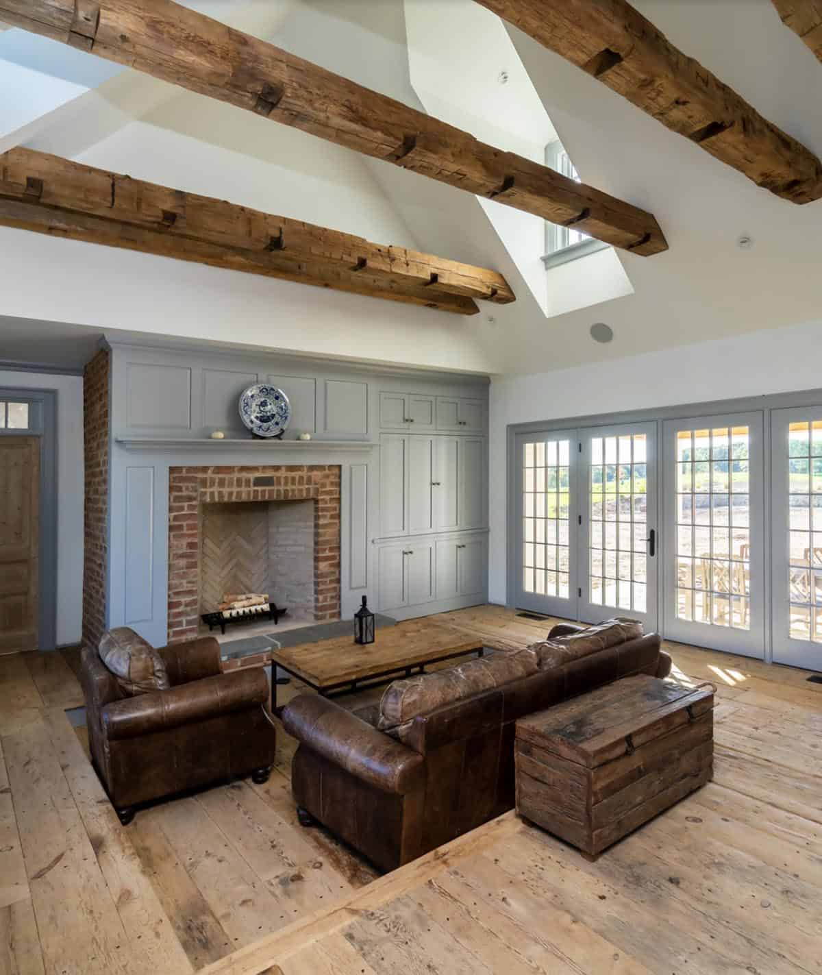 farmhouse style family room with a fireplace