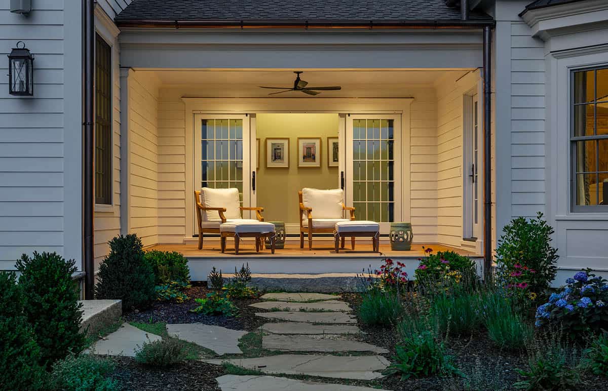 traditional style porch at dusk