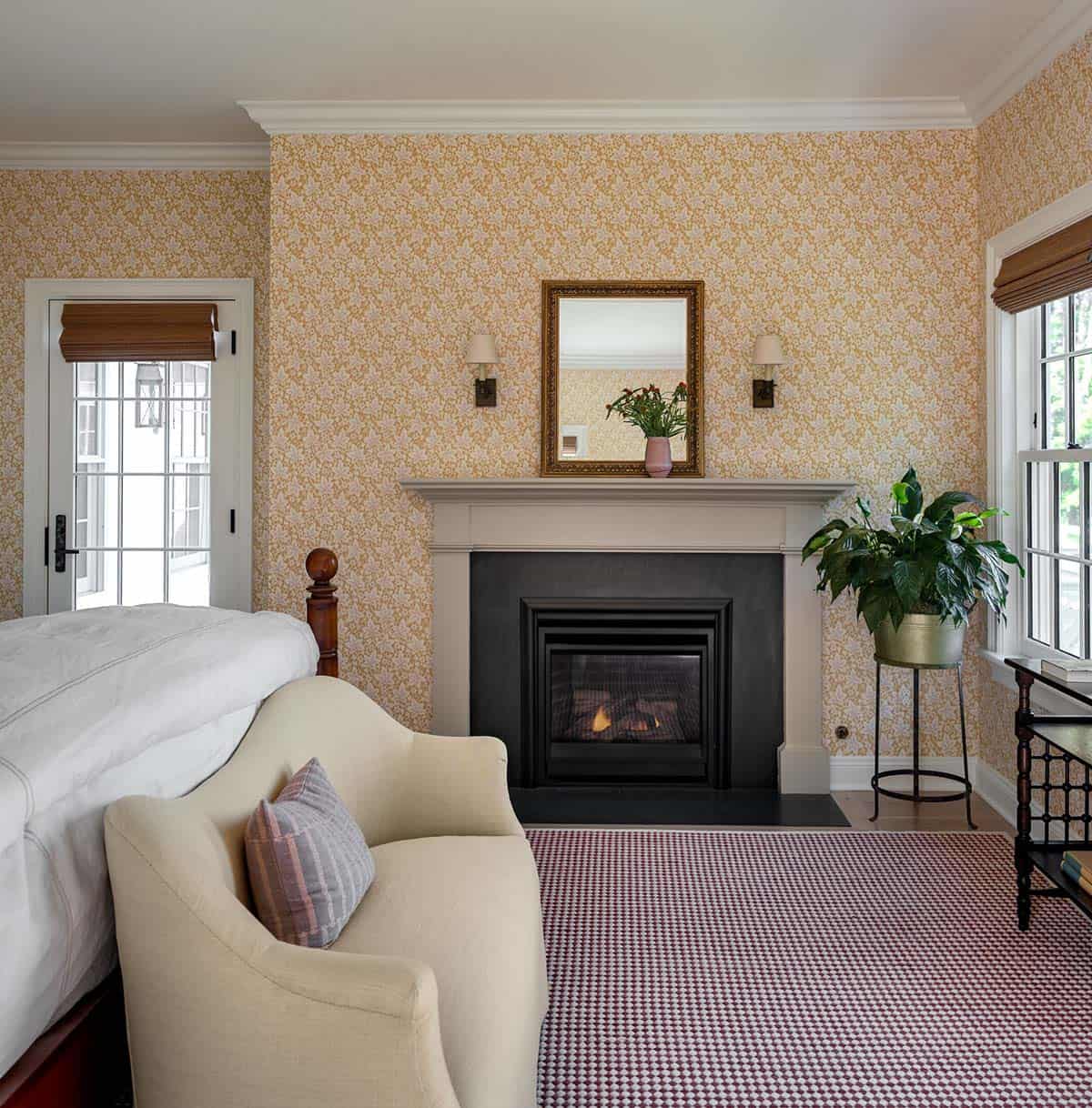 modern farmhouse style guest bedroom with a fireplace