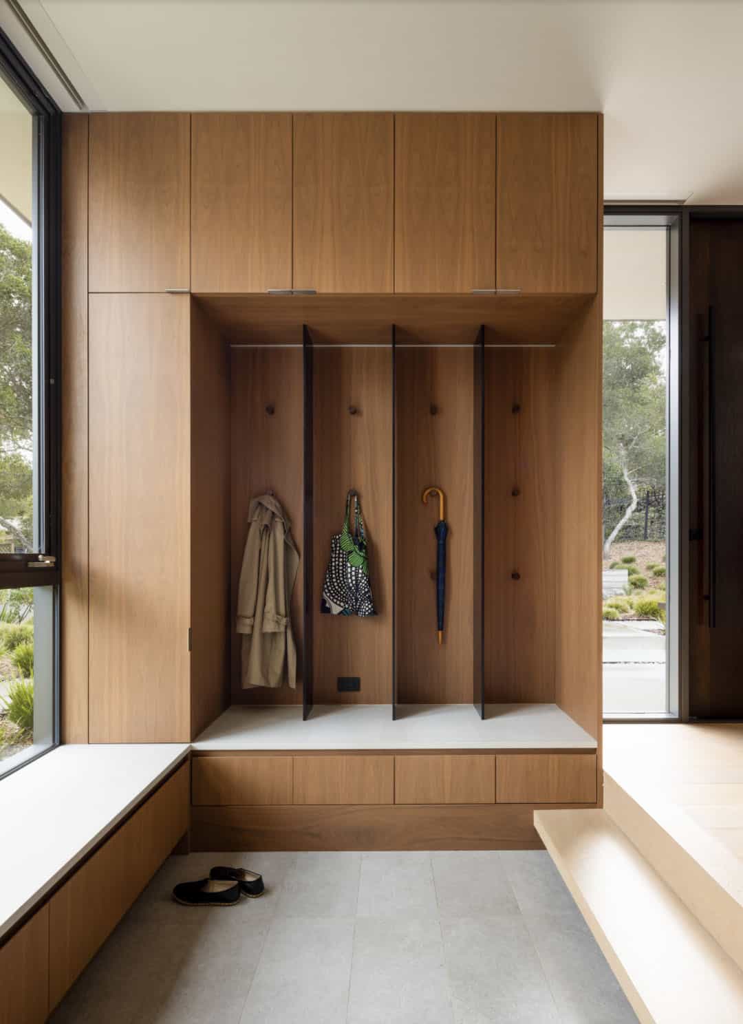 contemporary home entry with a built-in bench