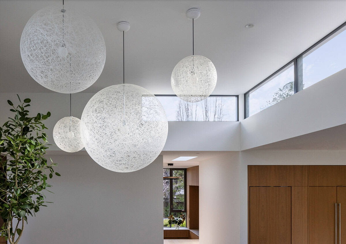 contemporary living room with large pendant lights