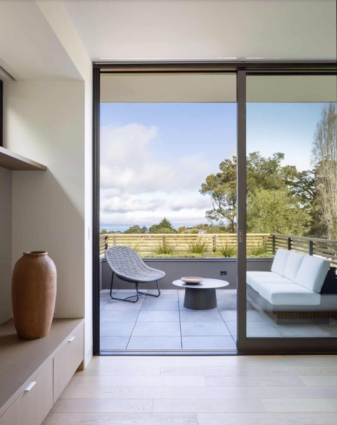 contemporary bedroom with a private deck