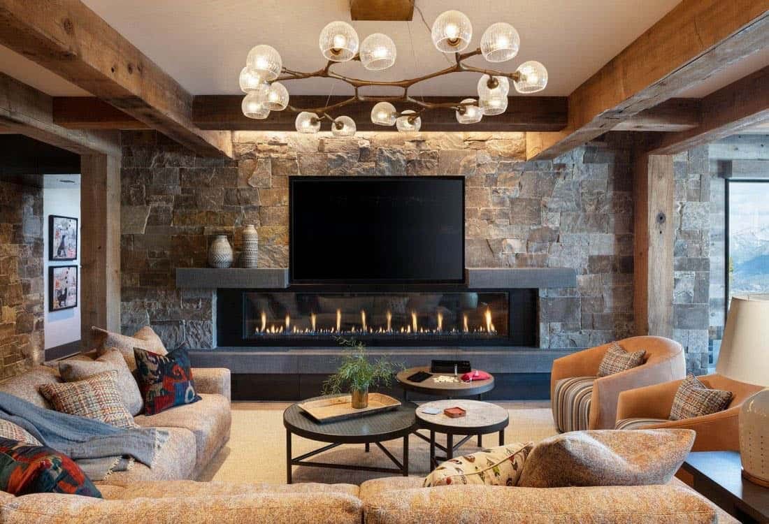 contemporary mountain house family room with a fireplace