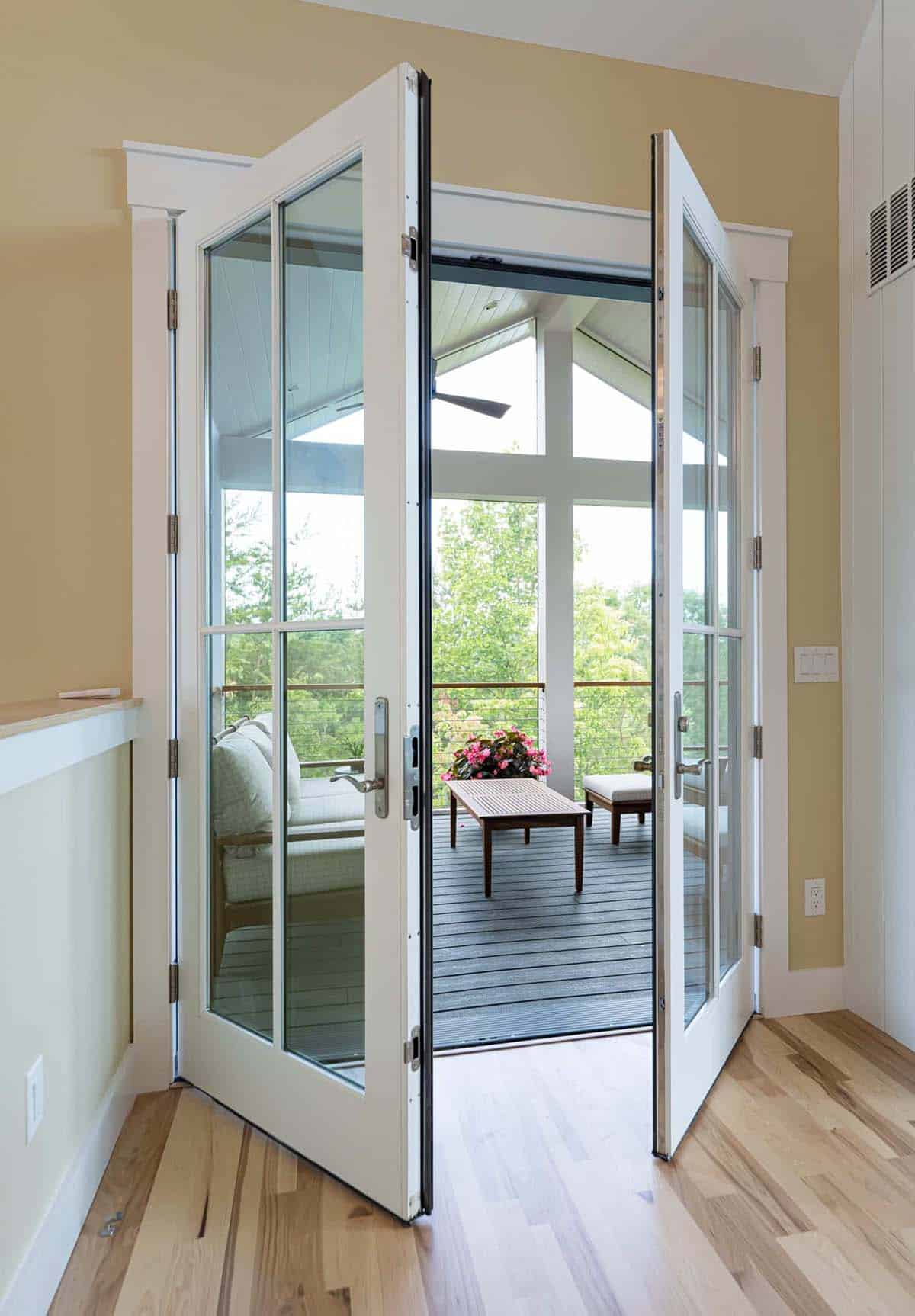 contemporary French doors leading out to a screened porch