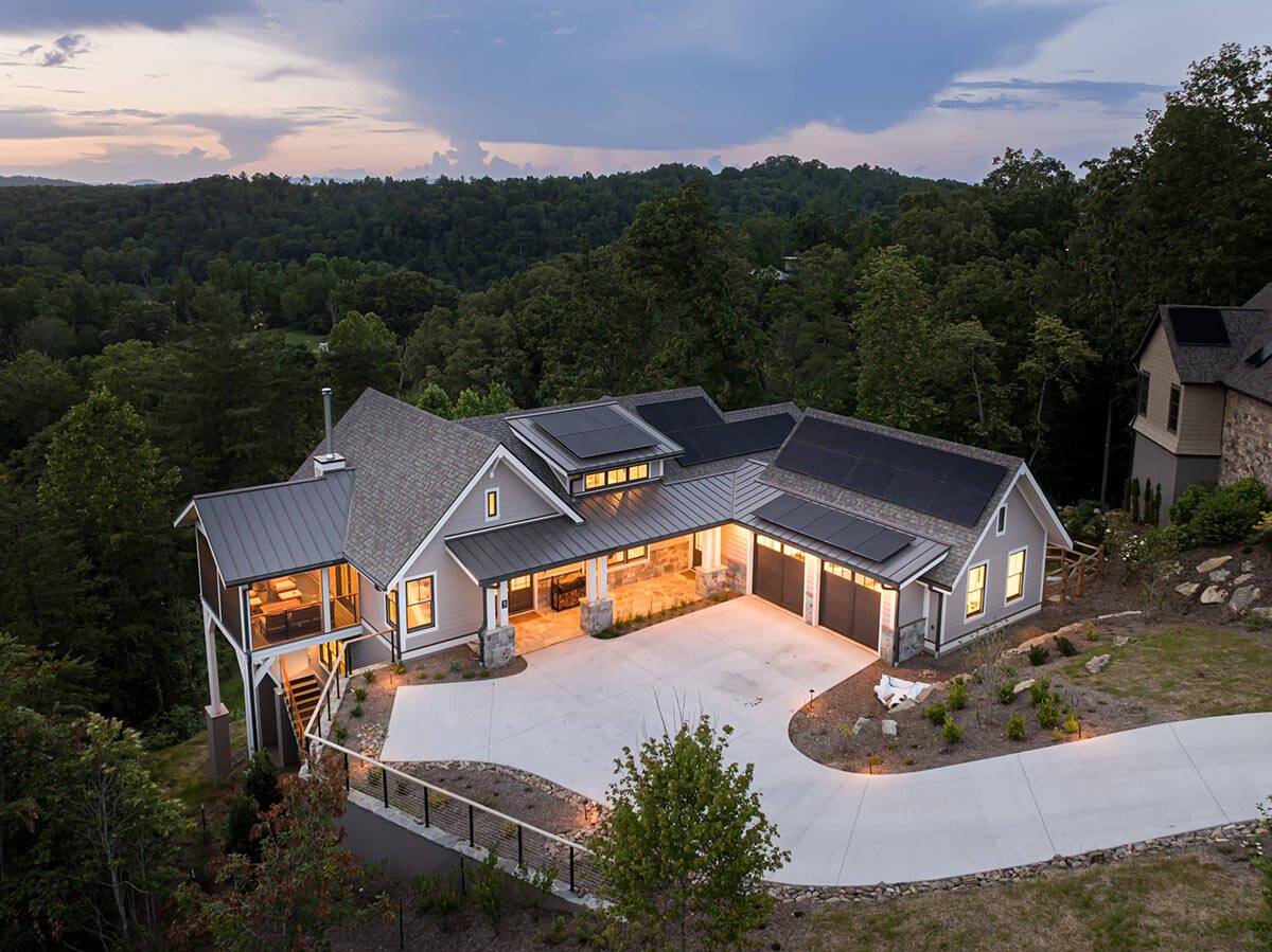 mountain modern home exterior at dusk