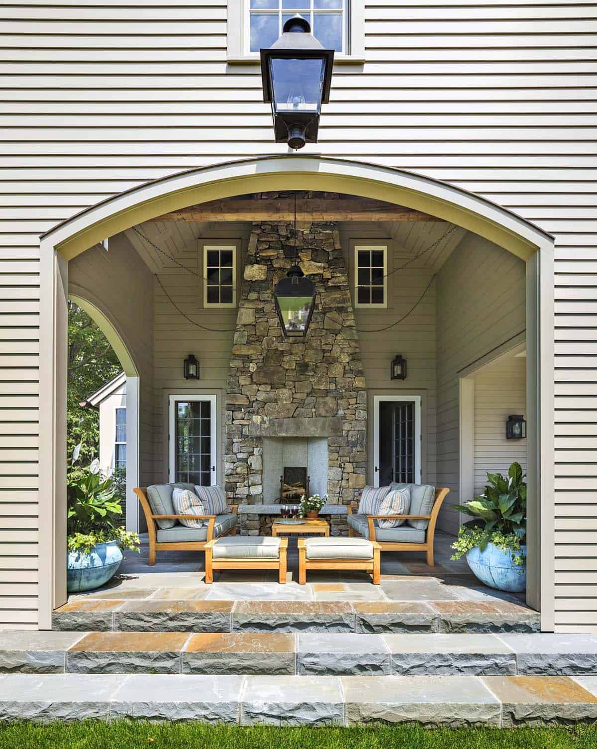 stone farmhouse exterior with a covered patio