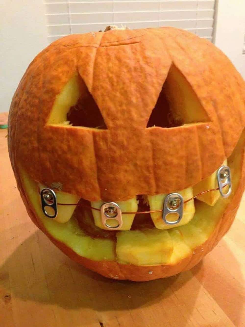 halloween carved pumpkin with braces
